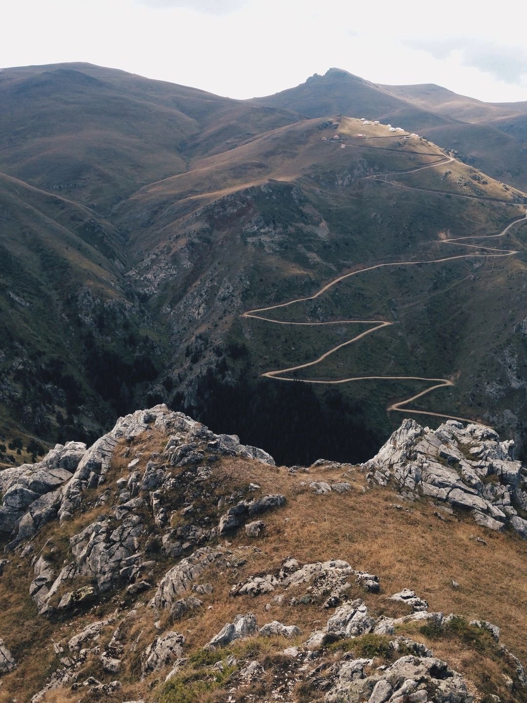 Winding mountain road illustrating long-distance freight delivery routes